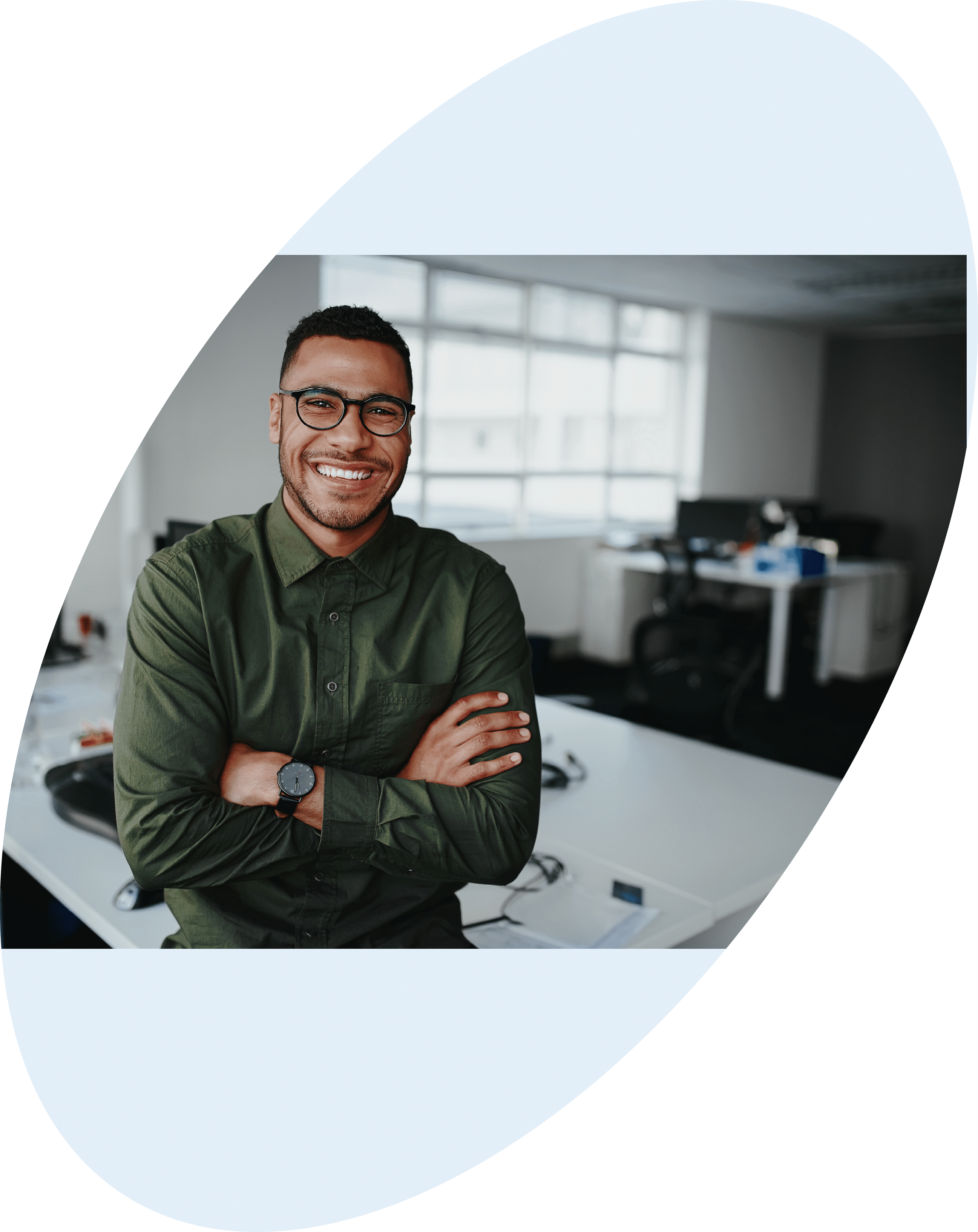 Portrait of young and successful businessman in modern office